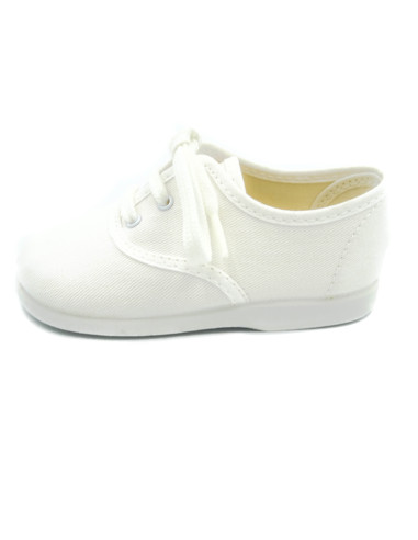 bamba de tela con los cordones al tono para nino