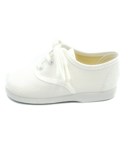 bamba de tela con los cordones al tono para nino