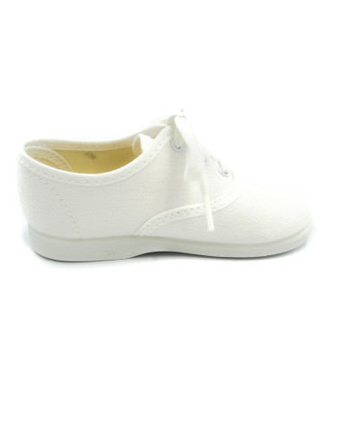 bamba de tela con los cordones al tono para nino