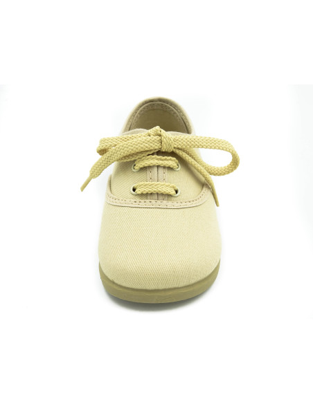 bamba de tela con los cordones al tono para nino