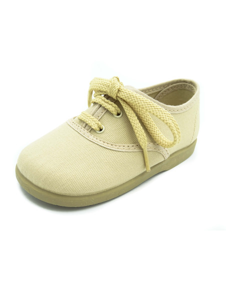 bamba de tela con los cordones al tono para nino