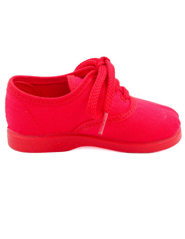 bamba de tela con los cordones al tono para nino