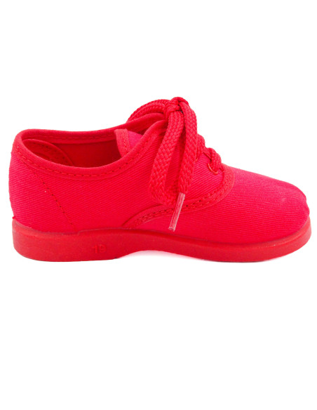 bamba de tela con los cordones al tono para nino