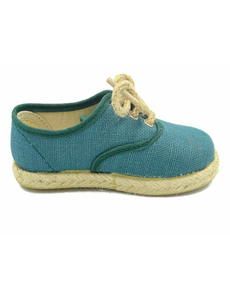 espartena de nino de lino con la suela de goma para ceremonia